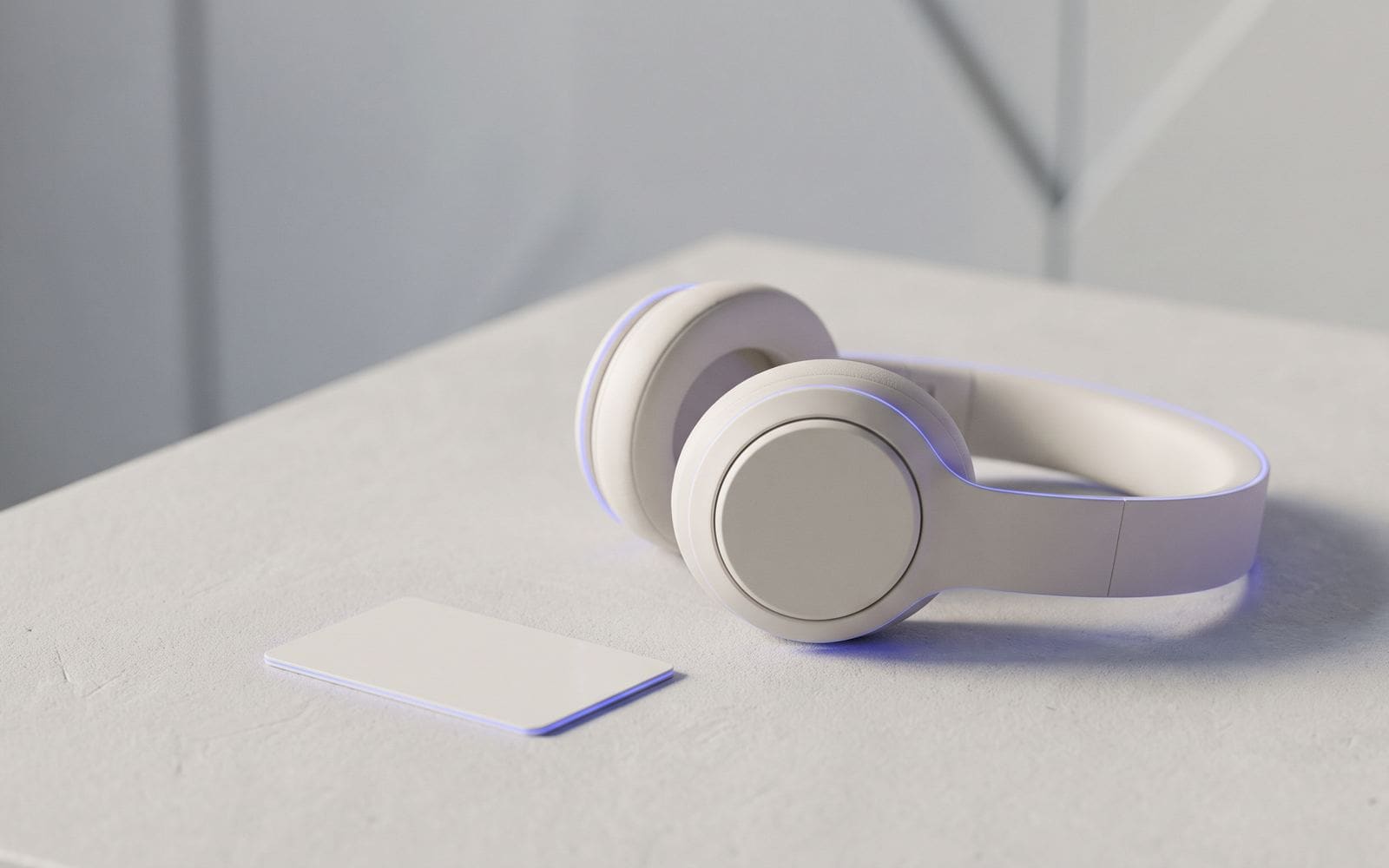 A headset resting on a desk beside a blank access badge